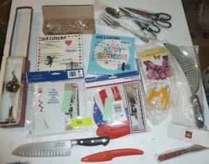 lot 44 image: Misc lot with napkins, knives, scissors, wind socks and more