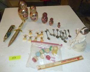 lot 53 image: Nesting dolls, knife, birthstone kids, collector spoons, Northwest Orient chopsticks and antique dresser scent balls