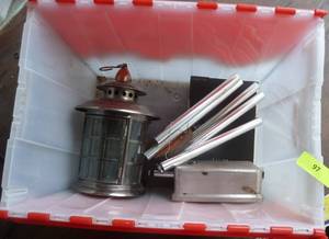 lot 97 image: tote full of misc items, bean pots, lantern, wind chimes, utensils