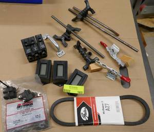 lot 165 image: Lot of hold down clamps, circuit breakers, motor brushes, digital readouts