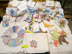 lot 211 image: Large group of linens, pillow cover, flour sack dish towel, table cloth and a whole bunch of handkerchiefs