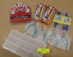 lot 234 image: Router Bits, small snips, caulk caps and Plano box