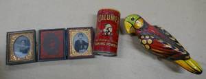 lot 52 image: Vintage items - 1967 Wrigleys gum box, Statue of Liberty radio, thimbles, Calumet tin, parrot, cedar bank