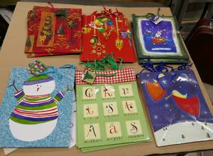 lot 239 image: 18 New Christmas gift bags 10x12