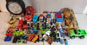 VINTAGE TO PRESENT LOT OF TOY CARS TRUCKS MOTORCYCLES HOT WHEELS SPIDERMAN CAR CARRIER NOISE MAKING TANK