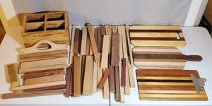 20 POUND BOX OF ASSORTED WOOD PIECES 2 CUTTING BOARDS CLIPBOARD AND WOODEN BOX HOLDER