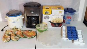 LOT OF KITCHEN ITEMS CROCKPOT COFFEE POT ICE CUBE TRAYS LARGE PITCHER STIRRING POPCORN MACHINE NEW OVEN MITTS TO GO SALAD BOWL DEVILED EGG HOLDER