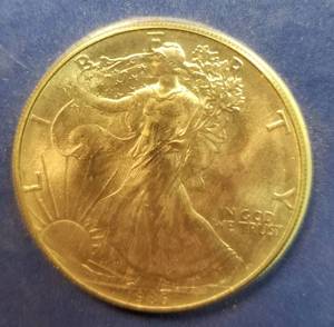 1986 AMERICAN SILVER EAGLE IN SEALED CATCH THE SPIRIT PACKAGING