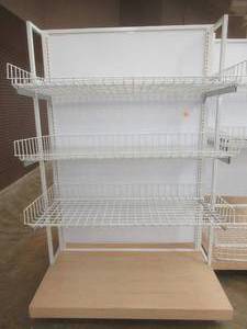 lot 69 image: Large Stationary Display Island With 6 Adjustable Wire Basket Shelves and Wood Base. Approximate Dimensions 51 x 50 x 77 Tall.