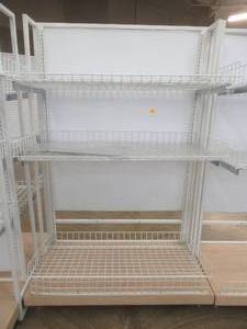 lot 70 image: Stationary Wall Display Rack With Adjustable Wire Basket Shelves And Wood Base. Approximate Dimensions 51 x 26 x 78 Tall.