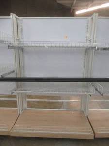 lot 72 image: Stationary Wall Display Rack With Adjustable Wire Basket Shelves And Wood Base. Approximate Dimensions 51 x 26 x 78 Tall.