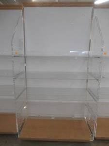 lot 78 image: Rolling Wall Display Unit With Plexiglass Shelving and Wood Base and Top Molding. Approximate Dimensions 48 x 24 x 91 Tall.