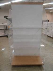 lot 79 image: Rolling Wall Display Unit With Plexiglass Shelving and Wood Base and Top Molding. Approximate Dimensions 48 x 24 x 91 Tall. Crack on Side-Wall.