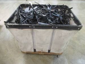 lot 80 image: Hamper Filled With Miscellaneous Plastic Hangers. Must take all.