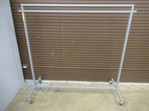 lot 22 image: Rolling Steel Clothing Rack. Approximate Dimensions 60 x 24 x 60 Tall.