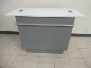 lot 138 image: DisplayCash Register Island, Approximate Dimensions 48 x 24 x 34 Tall. Removable Top, Slight Scratch and Dent.