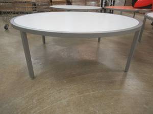 lot 157A image: Round Display Table, White Top, Approximate Dimensions 44 Dia x 15 12 Tall. Slight Scratch and Dent.