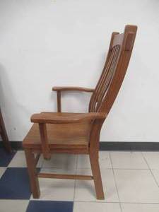 lot 180 image: Slat Back Wooden Arm Chair. Slight Scratch and Dent.