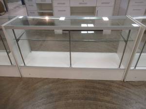 lot 229 image: Glass Lighted Display Case, Missing Back Doors, Includes 1 Glass Shelf, Approximate Dimensions 70 x 19 12 x 38 12 Tall.