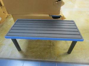 lot 504 image: 48 in Black Metal Patio Coffee Table (NICE CONDITION, BLUE TAPE COVERING COVERS TO PREVENT DAMAGE)