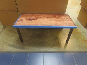 lot 509 image: 48 in Amagi Burl Coffee Table with Wood Look Top (NICE CONDITION, BLUE TAPE TO PREVENT DAMAGE TO CORNERS AND EDGES)