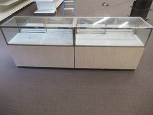 lot 266 image: Glass Display Cabinet With Ample Storage, Approximate Dimensions 196 x 20 x 37 12 Tall, Includes Key. Slight Scratch and Dent.