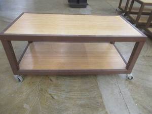 lot 287 image: Rolling Wooden 2-Tier Table With Steel Frame, Approximate Dimensions 48 x 24 x 21 Tall. Slight Scratch and Dent.