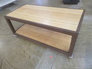lot 289 image: Rolling Wooden 2-Tier Table With Steel Frame, Approximate Dimensions 48 x 24 x 21 Tall. Slight Scratch and Dent.