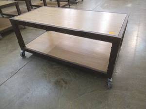 lot 290 image: Rolling Wooden 2-Tier Table With Steel Frame, Approximate Dimensions 48 x 24 x 21 Tall. Slight Scratch and Dent.