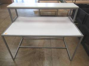 lot 324 image: Steel Table With Steel Frame and Removable Top Display Shelf, Approximate Dimensions 60 x 36 x 49 Tall. Slight Scratch and Dent, Bent Bottom Back Brace.