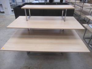 lot 337 image: 3-Tier Display Table. Approximate Dimensions 62 x 45 x 45 Tall. Slight Scratch and Dent.