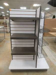 lot 345 image: Four-Sided Rolling Display Tower With Slat Walls And Adjustable Shelving, Approximate Dimensions 40 x 40 x 60 Tall.