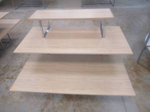 lot 334 image: 3-Tier Display Table. Approximate Dimensions 62 x 45 x 48 Tall. Slight Scratch and Dent.