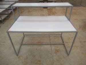 lot 329 image: Steel Table With Steel Frame and Removable Top Display Shelf, Approximate Dimensions 60 x 36 x 49 Tall. Slight Scratch and Dent.