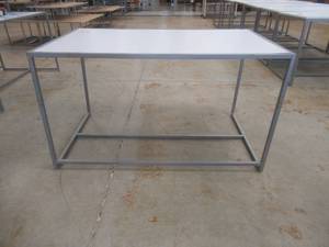 lot 320 image: Wood Top Display Table With Steel Frame, Approximate Dimensions 60 x 36 x 34 Tall. Slight Scratch and Dent.