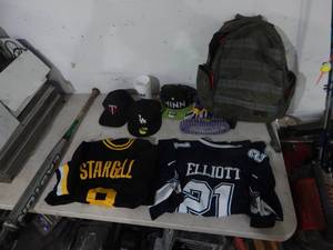 lot 60 image: Sports Related 2-Jerseys, 2-Hats, Bat, Backpack