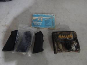 lot 68 image: Vintage M16A1 Manual, 3-AR Grips, Cartridge Holder