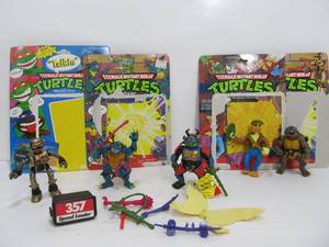 lot 17 image: Vintge TMNT Ninja Turtles Action Figures wAccessories and Card Backs