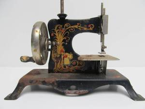 lot 162 image: Antique Tin Litho Toy Sewing Machine - Little Red Riding Hood