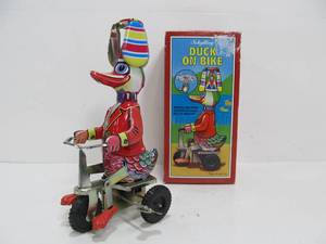 lot 301 image: Vintage Duck on Bike Wind-Up Toy Repro in Original Box
