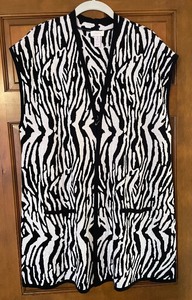 lot 213 image: 8 Charming Chicos Shirts and Vest
