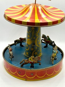 lot 168 image: Vintage Wolverine Supply and Manufacturing Company Carousel Mechanical Toy