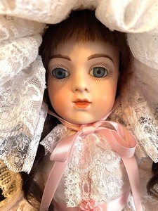 lot 18 image: Beautiful Antique Doll by Butler