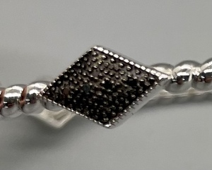 lot 26 image: Sterling Silver Bangle Bracelet with Diamond Shaped Accents