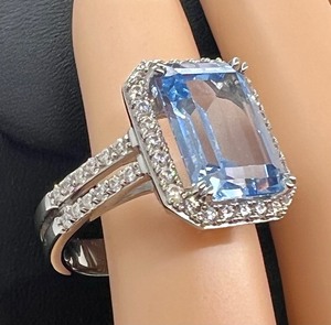 lot 64 image: Dazzling Sterling and Blue Topaz Cubic Zirconia Ring