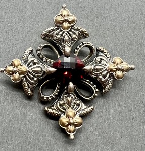 lot 66 image: Barbara Bixby 18k, Sterling and Garnet Pendant