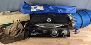 lot 179 image: Camping Equipment Lake Trail Folding Sports Chair, Sleepcell Sleeping Bag, The Outdoor Great Room Company Cook Number Grill, Plano Tackle Box, & More R