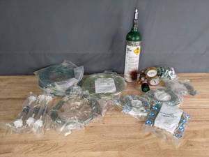 lot 184 image: Compressed Oxygen Tank, Assorted Tubes, and Mask R