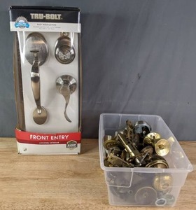 lot 159 image: Door Hardware Lot  TruBolt Front Entry Set & Bin of Doorknobs, Deadbolts, and More  R