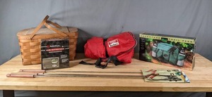 lot 210 image: Wood Picnic Basket with Plates & Utensils, RadioShack Weather Radio, (2) 2-Pack Camp Forks, Marlboro Unlimited Sleeping Bag, Adventure Trail Pack H